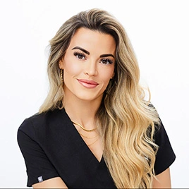 shelby miller, founder of ruma aesthetics, looking at camera and smiling